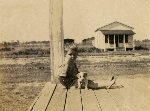 George Barton Hall, Jr., the first child born in Hall City. The building across the street was the office of his father George Barton Hall, Sr., general manager of the planned community (photo 1915).