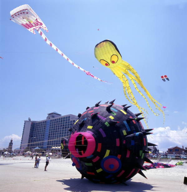 These folks have the right idea - flying kites at the Daytona Beach Kite Festival where there's lots of room (1993).