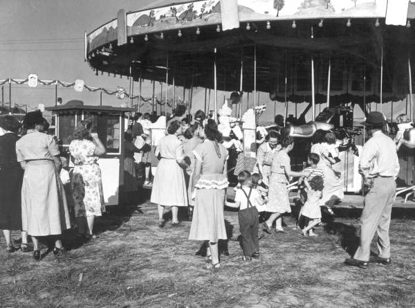 Merry-go-rounds and other carnival rides are generally still taxed, but not usually by their specific names. Here's a merry-go-round at the Quincy Tobacco Festival (1949).