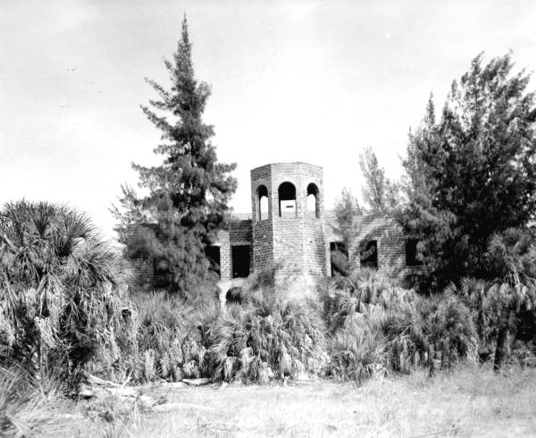 The unfinished Ringling Ritz-Carlton Hotel fades slowly into the landscape (1959).