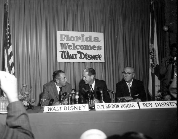 Walt Disney, Governor Haydon Burns, and Roy Disney at a press conference announcing plans to build a Disney resort in Florida. The conference was held at the Cherry Plaza Hotel in Orlando (November 15, 1965).