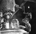 A Newport Industries worker filling a drum with rosin in a plant - Pensacola, Florida.