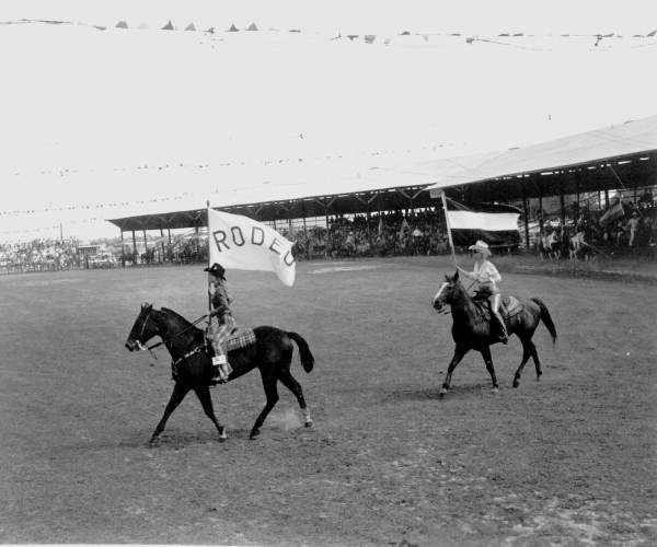 Riders carry flags around the arena at Arcadia (1971).