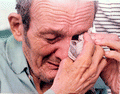 Cuban refugee breaks down upon his arrival at Key West, Florida from Mariel, Cuba during the Mariel Boatlift.