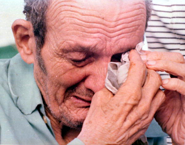 Cuban refugee breaks down after arriving in Key West during the Mariel Boatlift. Photograph by Dale McDonald, 1980.