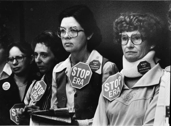 Anti-ERA activists line the wall of the Florida Senate chamber, 1979.