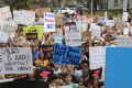 Close-up view showing student demonstrators with their signs at the Never Again Rally in Tallahassee.