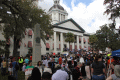 Crowd listening to speeches during the Never Again Rally at the Old Capitol in Tallahassee.