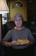 Angie Poulos, member of Tallahassee's Holy Mother of God Greek Orthodox Church, holding paximadia cookies in Thomasville, Georgia.