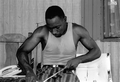 Alphonso Jennings cutting white oak into strips to make a basket - Lamont, Florida