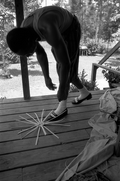 Alphonso Jennings laying white oak into a pattern to begin making a basket - Lamont, Florida