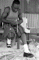 Alphonso Jennings cutting white oak into strips to make a basket - Lamont, Florida