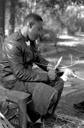 Alphonso Jennings cutting white oak into strips to make a basket - Lamont, Florida