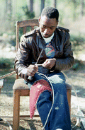 Alphonso Jennings cutting white oak into strips in order to make baskets - Lamont, Florida