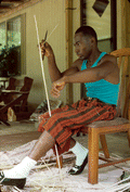 Alphonso Jennings cutting strips of white oak to make a basket - Lamont, Florida