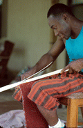 Alphonso Jennings cutting strips of white oak to make a basket - Lamont, Florida