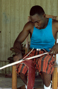 Alphonso Jennings cutting strips of white oak to make a basket - Lamont, Florida