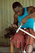 Alphonso Jennings cutting strips of white oak to make a basket - Lamont, Florida