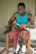 Alphonso Jennings cutting a strip of white oak for basket making - Lamont, Florida