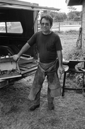 A farrier shows off his tools.