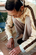 Tuyen Pham making a vietnamese basket - Pensacola, Florida.