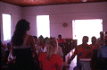 Girls singing from Sacred Harp book before congregation at the Bethlehem Primitive Baptist Church