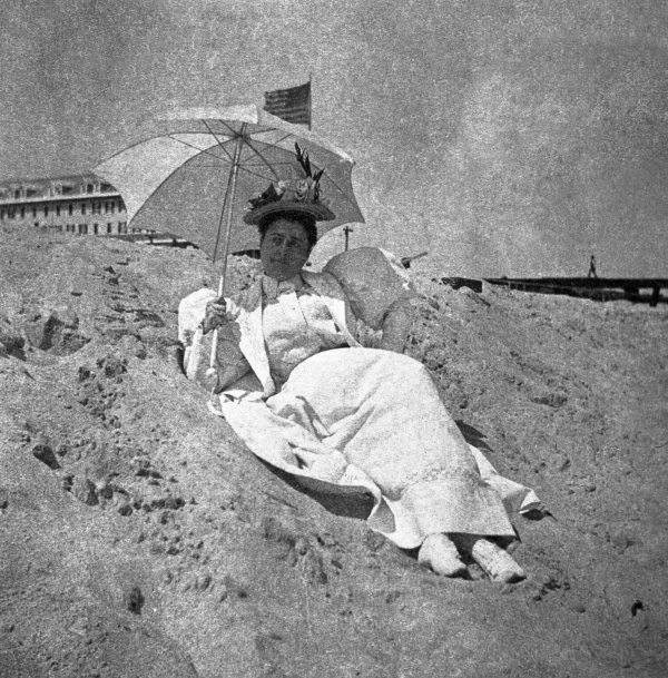 Lady in white reclining on the beach - Palm Beach, Florida