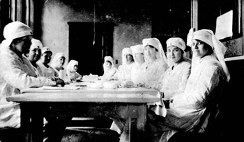 Red Cross volunteers rolling bandages