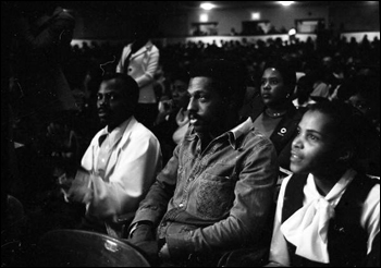 View showing audience in auditorium listening to civil rights speakers (ca. 1975)