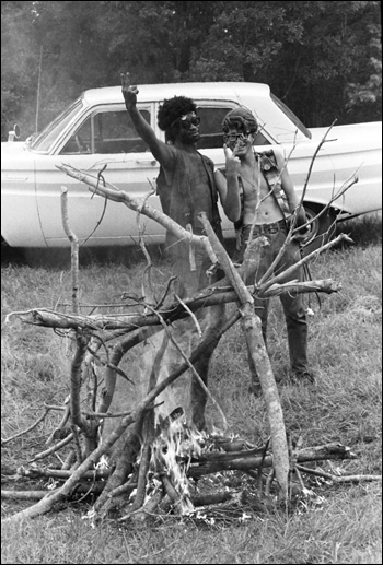 Young men at the 1970 Florida Folk Festival giving the peace/victory sign: White Springs, Florida (1970)