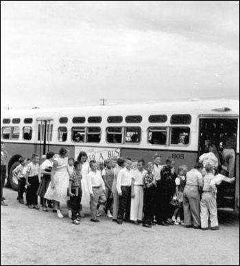 Children boarding bus for school: Saint Petersburg, Florida (October 1956)