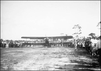 Crowd gathered around a biplane, part of Mabel Cody's Flying Circus: Coral Gables, Florida (1922)