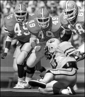 Quarterbeck Shaun Shehan takes on University of Florida's defensive line: Gainesville, Florida (1988) 