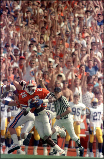 Defensive back Richard Fain heads to the endzone to the delight of the fans: Gainesville, Florida (1988)