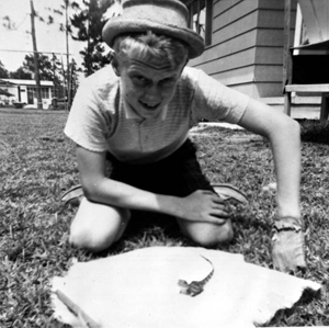 Chip Bloyd in his backyard with baby alligator purchased at Silver Springs: Panama City, Florida (1962)