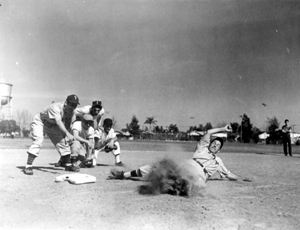 Bitsy Mott, left, instructor, Ben Podolsky, of Philadelphia, demonstrates hook slide: Tampa, Florida (1948)