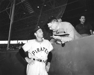 Pirate player at the Pittsburgh-Baltimore exhibition game chatting with general manager Branch Rickey (1955)