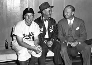 Red Barber sitting with friends before a baseball game (1949)