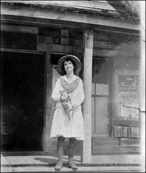 Dollie Booth on the porch of Booth's store (192-)