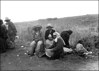 Migrant vegetable pickers waiting to be paid: Homestead, Florida (1939)