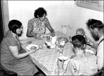 Family of migrant workers having supper