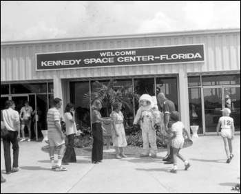 Costumed Spaceman greets tourists at Kennedy Space Center: Cape Canaveral, Florida (19--)