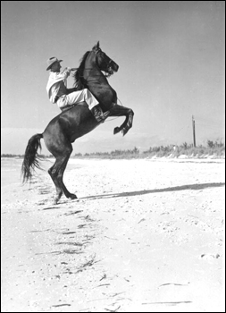 Rancher, Jim Dandy with his horse Lightning: Pass-A-Grille, Florida (1947)