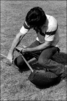 Man practicing for the rodeo with a calf tying jig: Macclenny, Florida (1984)