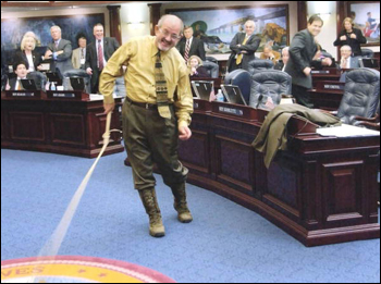 Rep. Dwight Stansel, D-Live Oak, demonstrates as part of "Boot Day" activities his bull whip expertise on the House floor during the 2005 Legislature (2005)