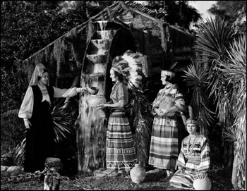 Young women drink at the "Fountain of Youth" at the Distant Drums premiere: Saint Augustine, Florida (1951)