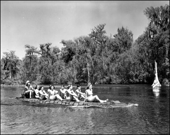 Wakulla Springs' visitors enjoying the ride down river aboard the seatless "alligator boat" (1941)