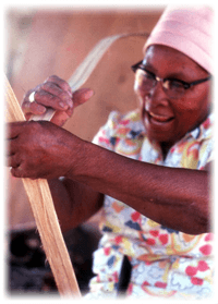 Lucreaty Clark peeling strips of white oak to make baskets