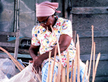 Lucreaty Clark looking for another strip of white oak to continue making her basket