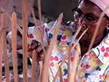 Lucreaty Clark weaving her white oak basket